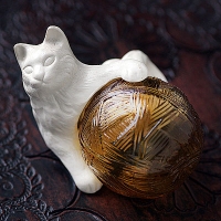 Avon-A Cat Perfume Bottle That Plays With A Ball Of Yarn